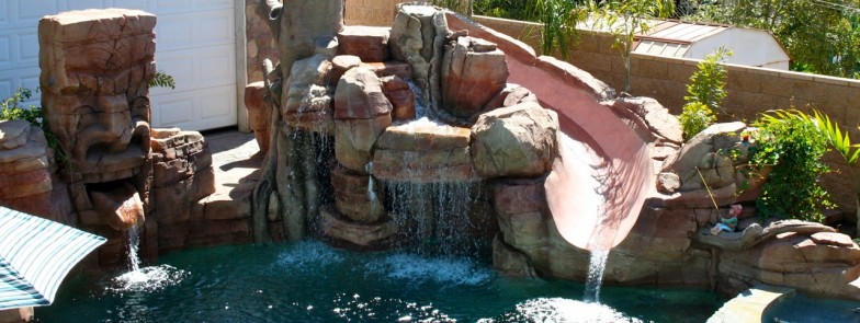Pool slide in Southern California, blending natural rock formations with playful features, providing an irreplicable experience for all ages in the summer.