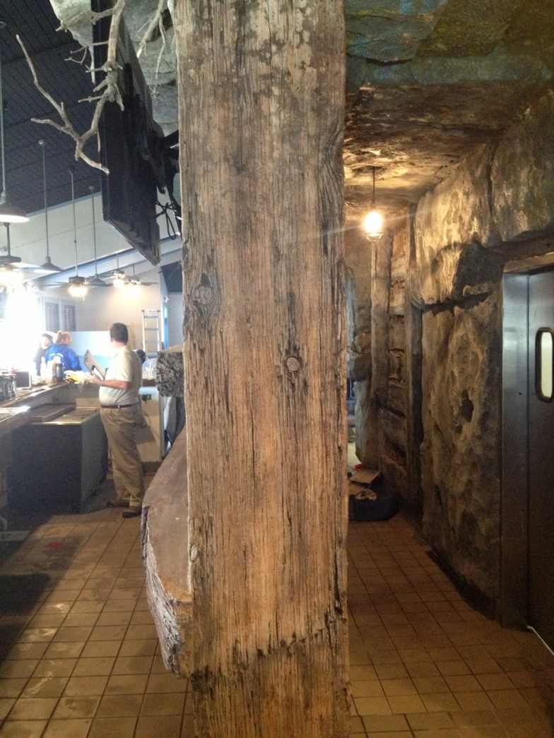 Fossil-themed bar interior with ancient artifacts, providing a unique and memorable ambiance for guests in Westminster California.