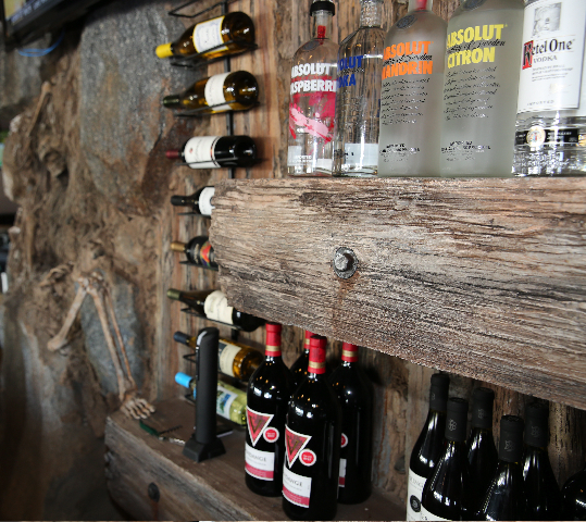 Fossil-themed bar interior with ancient artifacts, providing a unique and memorable ambiance for guests