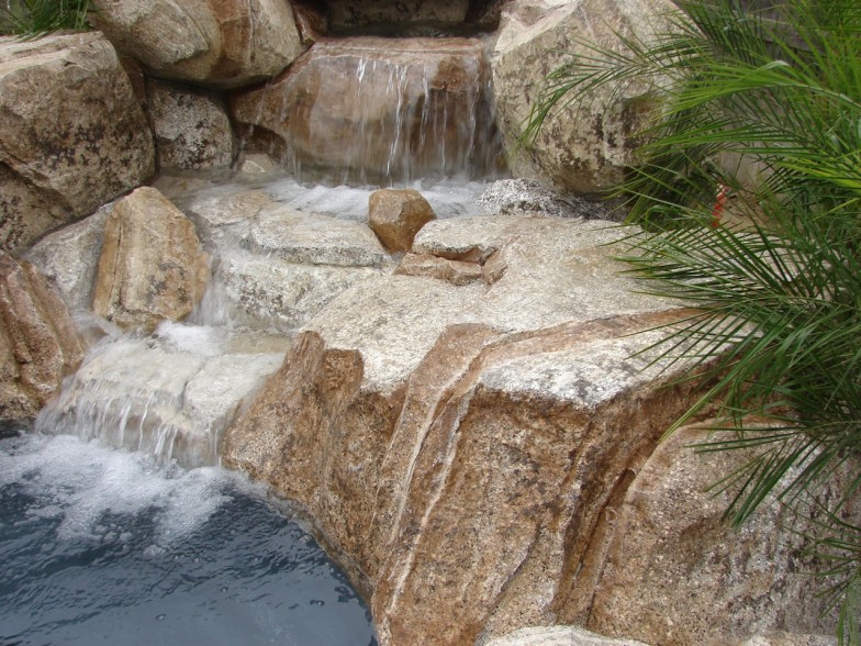 Custom waterfall feature, creating a relaxing pool environment in Fountain Valley CA